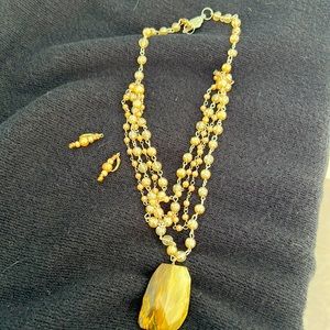 Keren Creations bespoke amber colored pendant necklace with matching earrings.